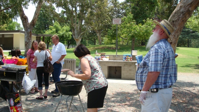 Cristy (Estrada) Atherton and Ed Hollis (Class of 66) cooked the hot dogs for the group.